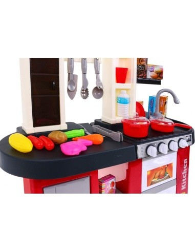 Kitchen with fridge, water tap